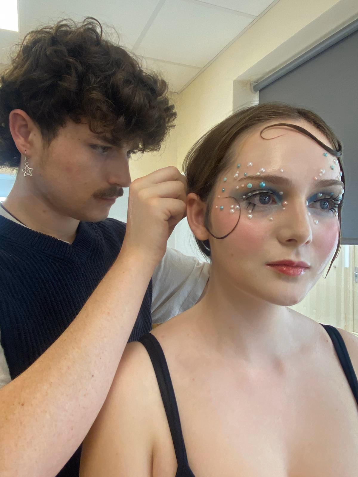 A makeup artist working on a film production